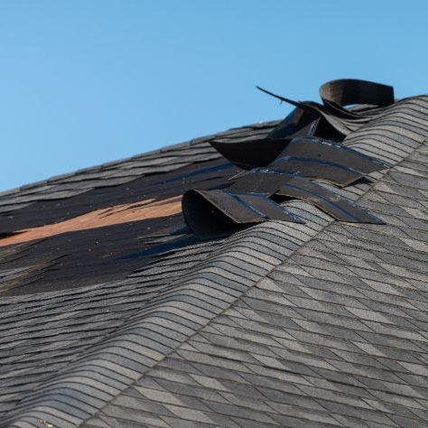 Roof damaged by storm, in need of repair
