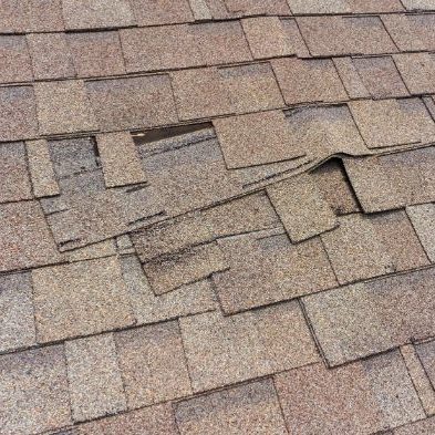 Damaged roof in need of roof repair from Canyon Construction Services in Twin Falls, ID